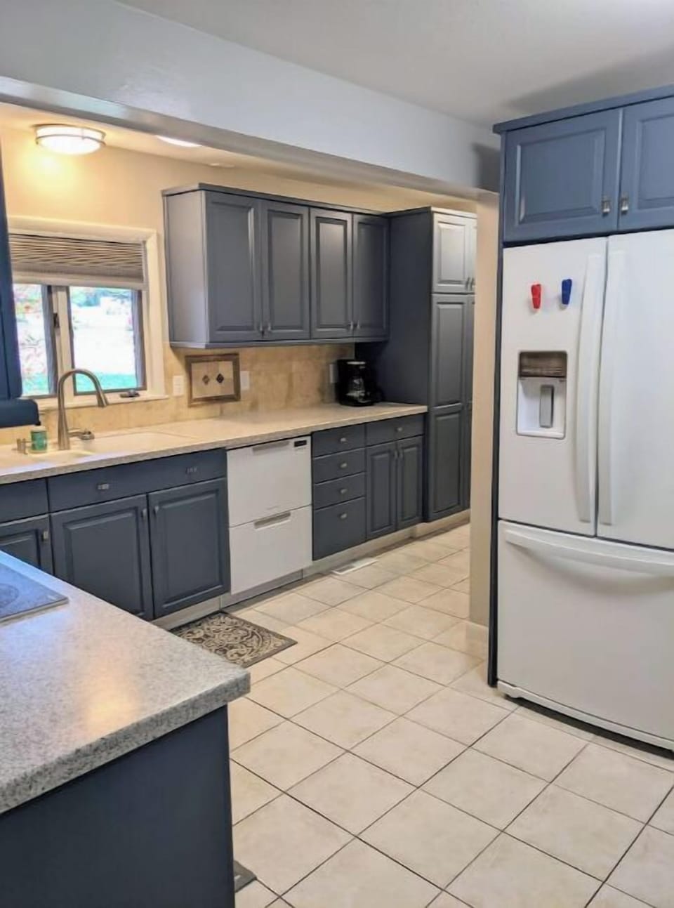 Kitchen and fridge with ice maker