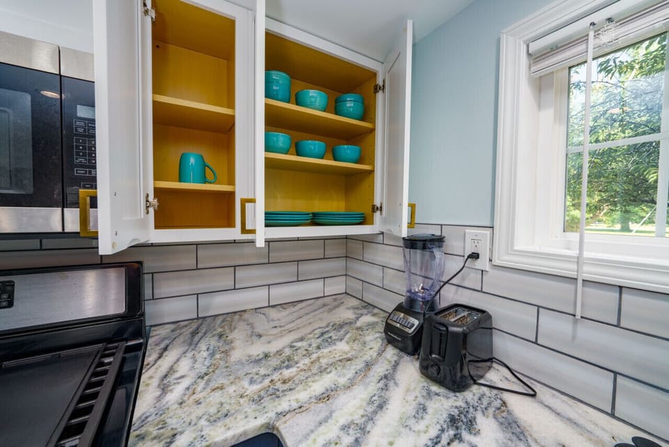 Beautifully appointed kitchen closet – your recipe for a delightful stay.
