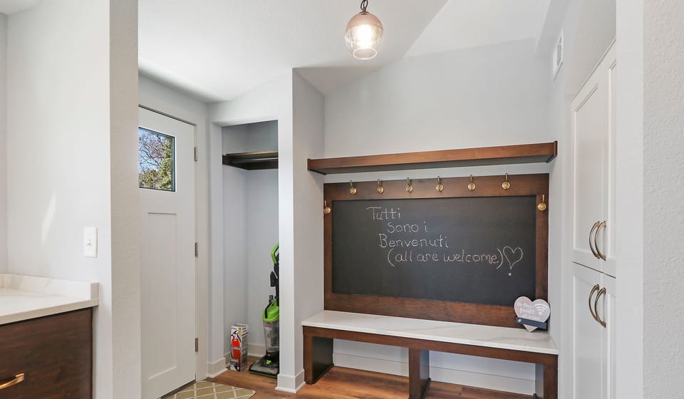 Back door leading to large patio with firepit and outside dining area. Handicap entrance with ramp