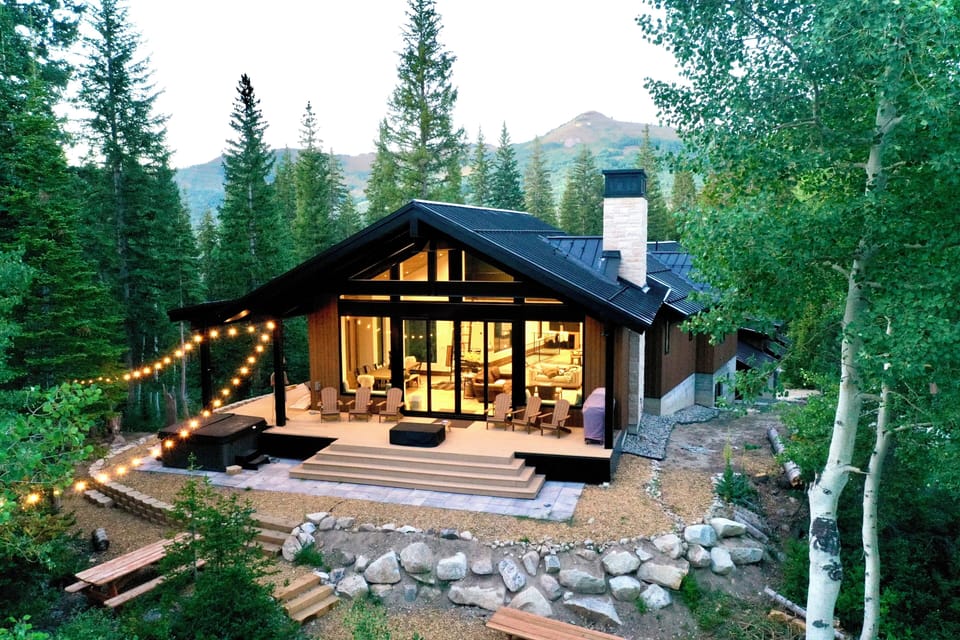 Back of home with Mountain View and two picnic tables.