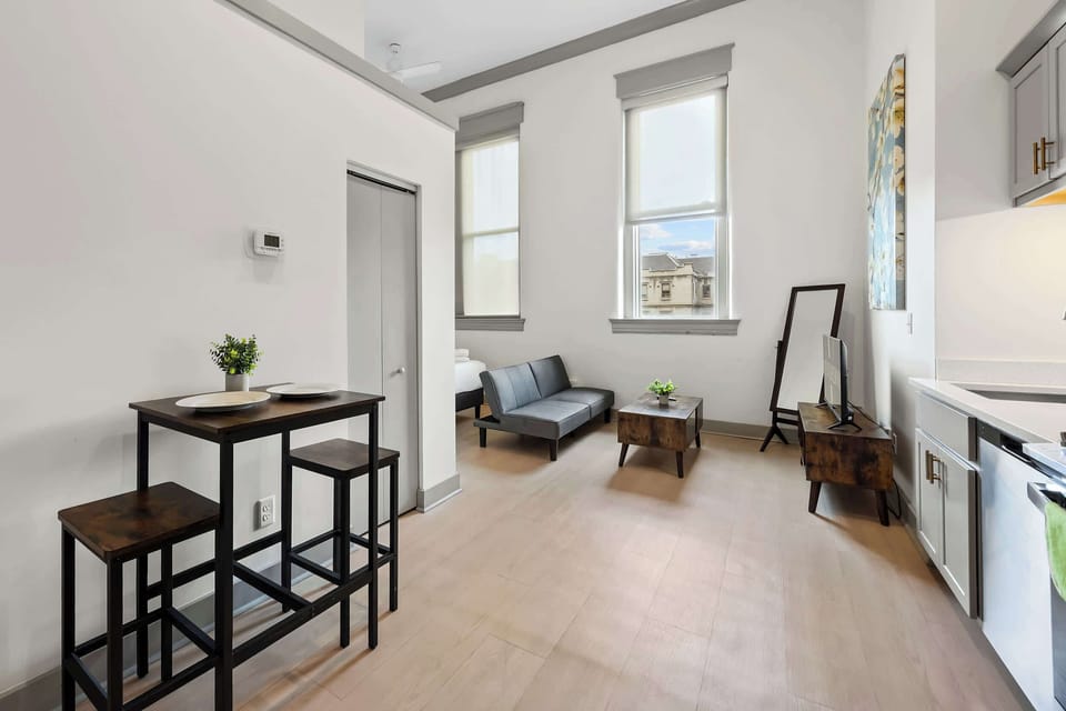 Kitchen: Modern kitchen with sleek stainless-steel appliances, a cozy dining area and ample counter space.