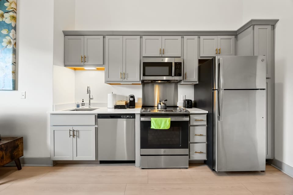 Kitchen: Modern kitchen with sleek stainless-steel appliances, a cozy dining area and ample counter space.