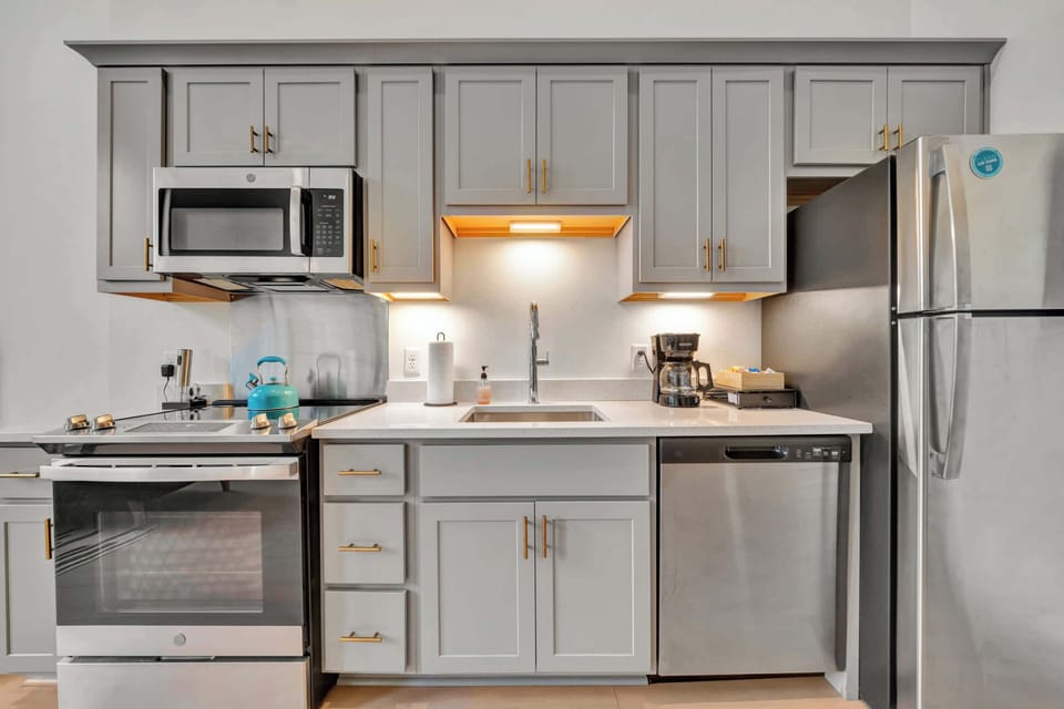 Kitchen: Spacious kitchen with updated cabinetry and modern appliances. 