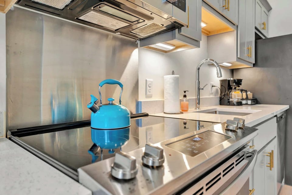 Kitchen: Spacious kitchen with updated cabinetry and modern appliances. 