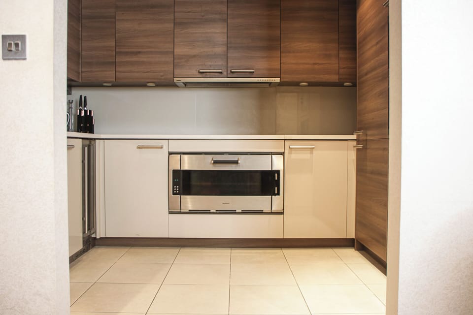 Fully equipped kitchen with oven and ample storage for all your needs.