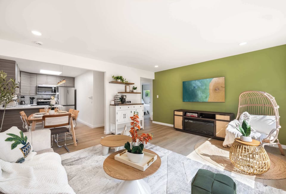 A spacious and airy living room with stylish furniture, perfect for relaxing or entertaining.