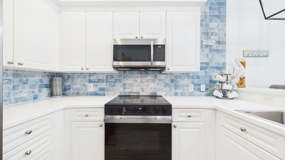 Full kitchen with stainless appliances and all the cooking essentials