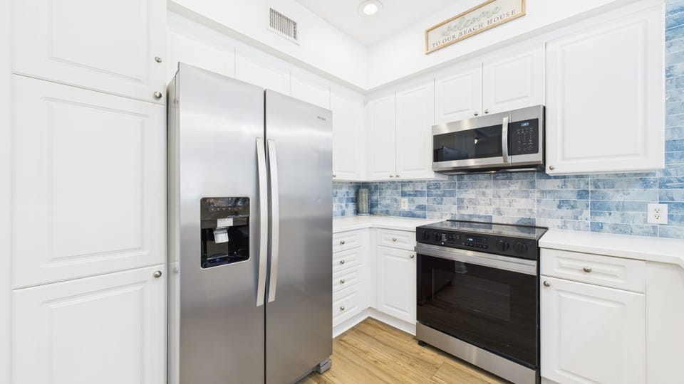 Full kitchen with stainless appliances and all the cooking essentials