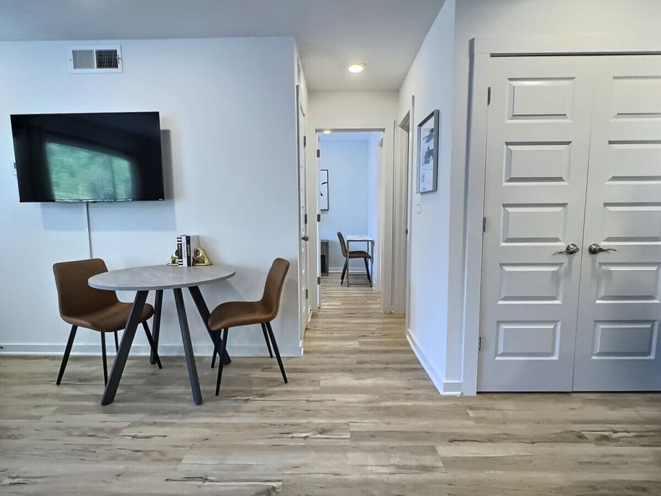 Enjoy your meals in this bright and inviting dining space, perfect for a short-term rental.