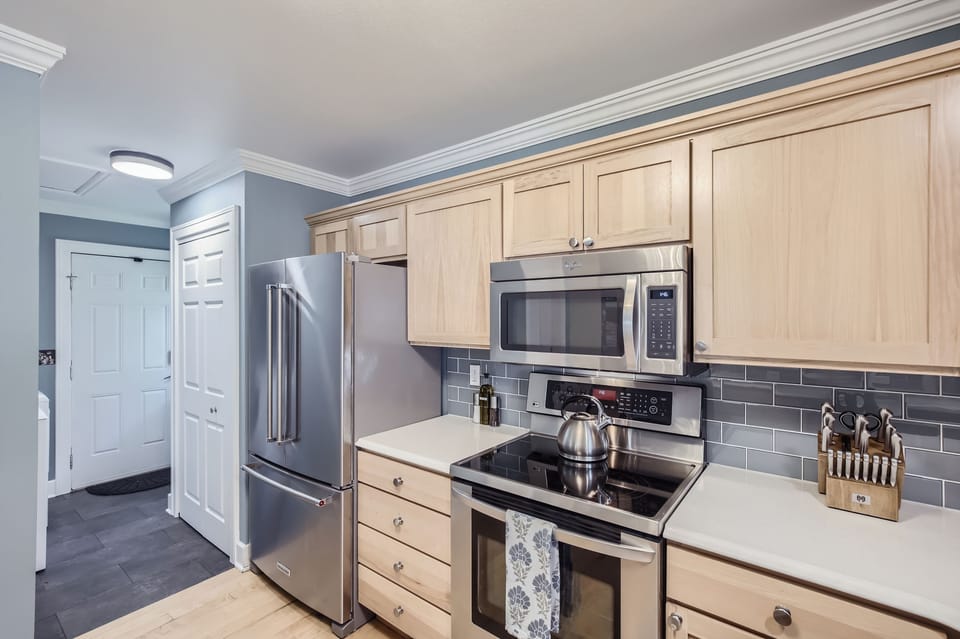 Kitchen opens to a pantry and laundry area