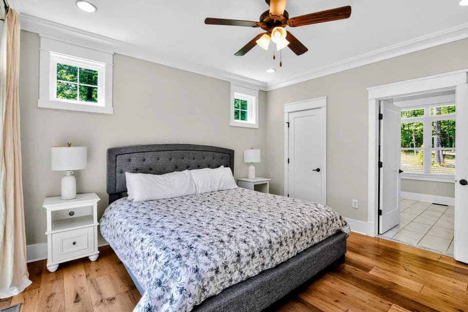 Suite 1 - Upholstered king bed with the en-suite bath right through the door, a private little wing of its own.