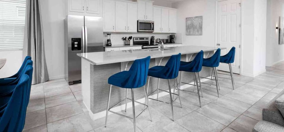 Fully equipped kitchen with seating in front, perfect for meals and conversations.