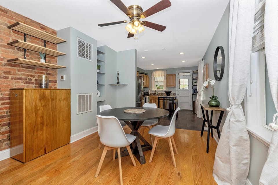 Dining area and kitchen. Ceiling fan for temperature comfort and TV with Roku. 