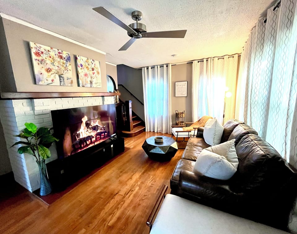 A cozy living room with 65 inch smart TV