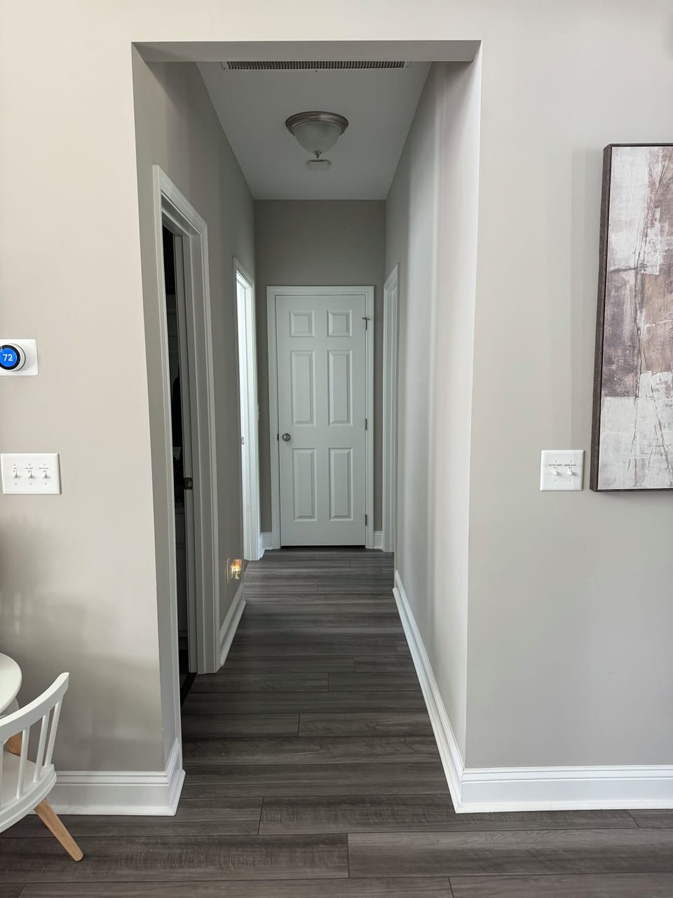 Hallway with two guest bedrooms and guest bathroom.