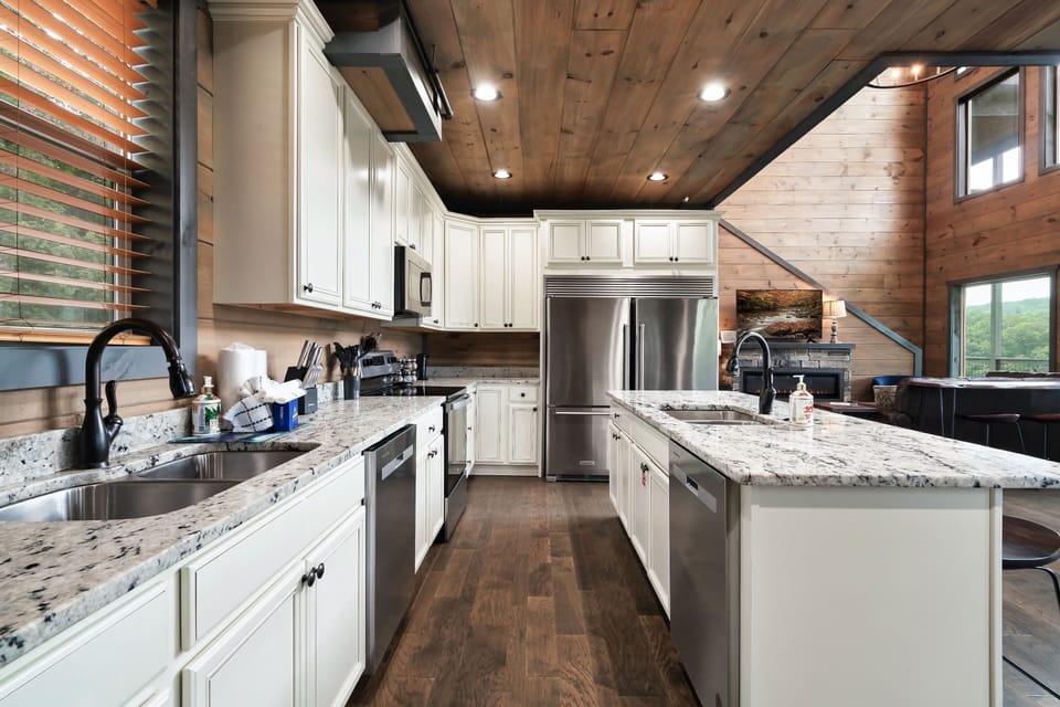 Whip up tasty meals in a rustic-modern kitchen with granite counters, appliances