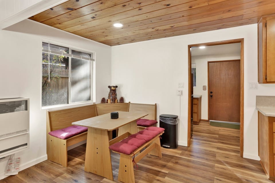 Fully equipped cabin kitchen with ample cabinetry, stove, fridge, and a coffee maker—perfect for cooking meals, morning coffee, and feeling right at home on your stay.