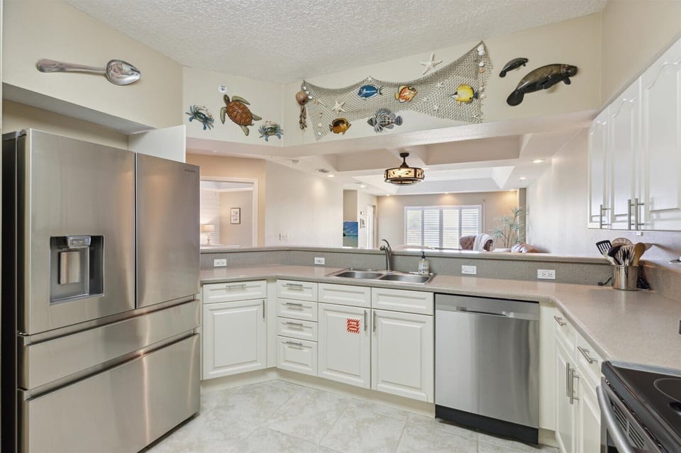 Step into the open kitchen, where modern appliances, sleek countertops, and bright lighting make every meal a pleasure to prepare.