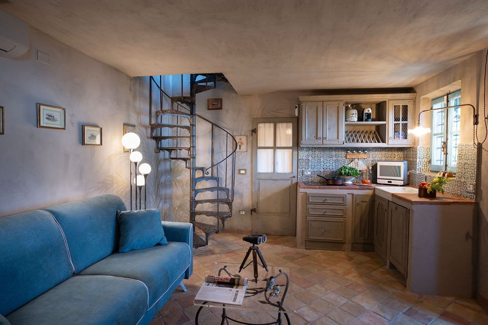 Cabinetry, Furniture, Property, Picture Frame, Countertop, Couch, Blue, Interior Design, Wood, Lighting