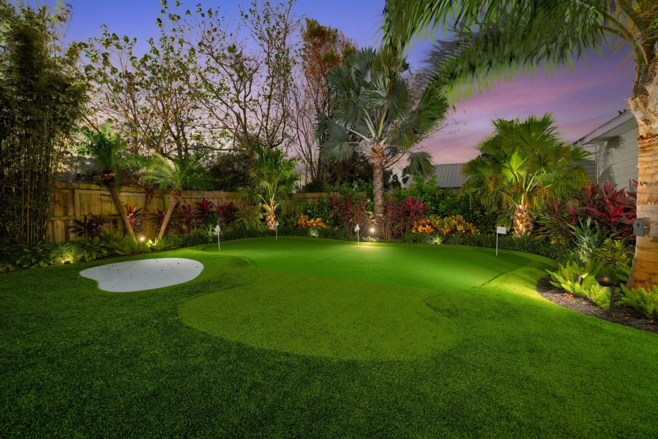 Fenced backyard with tropical landscaping for privacy