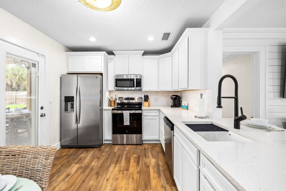 Fully equipped modern kitchen with stainless steel appliances, spacious countertops, and everything you need to cook with ease during your stay.