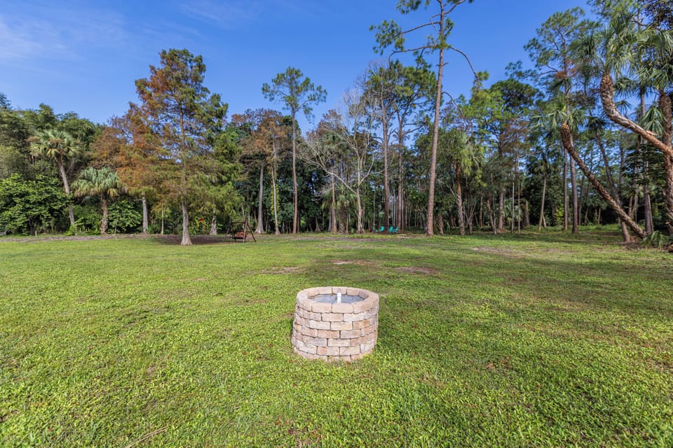 The well, a dot in the ample yard.
