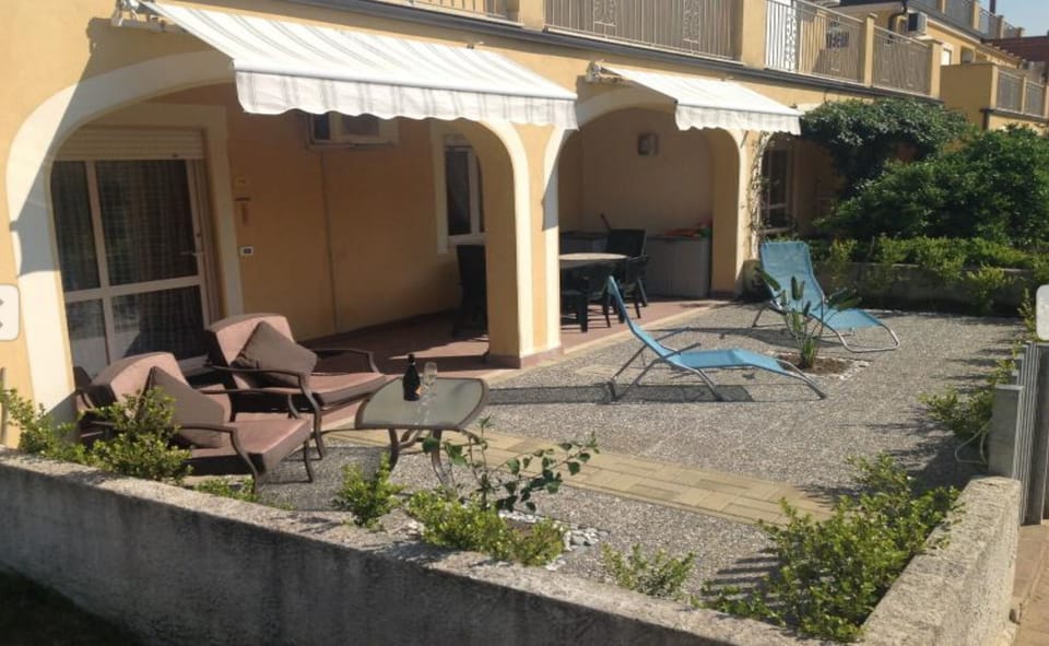 Outdoor patio with furniture and awning