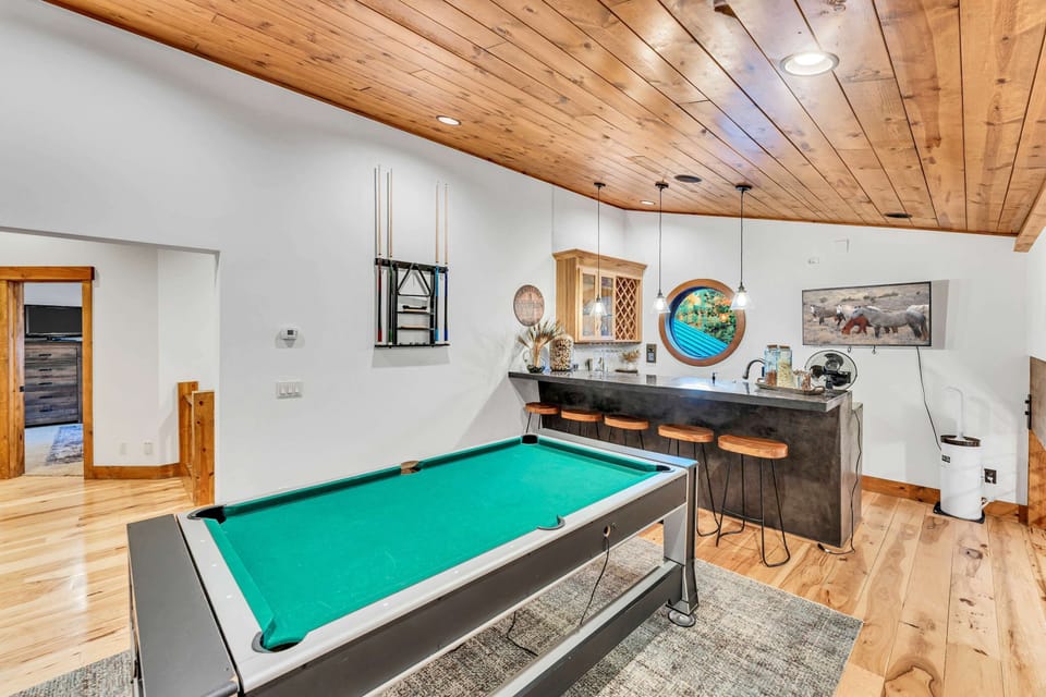 Game Room: Pool table, 46” Smart TV, full wet bar, 4 bar stools, second floor

