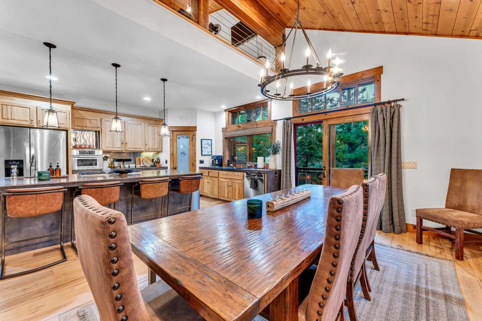 Dining Room: 10-person dining table, open layout to kitchen and living room
