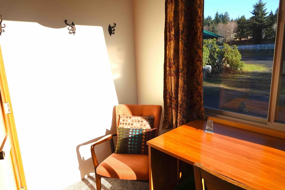 Bedroom 1 has a twin XL, generous desk and sitting space. 