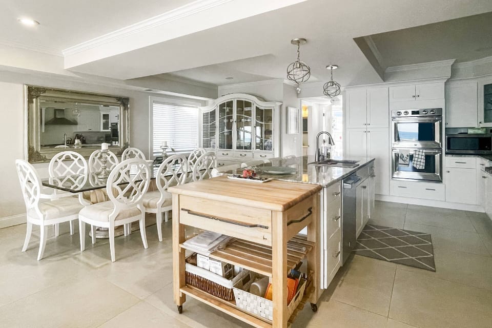 The huge kitchen island is perfect for gathering, cooking, and making memories with family and friends.