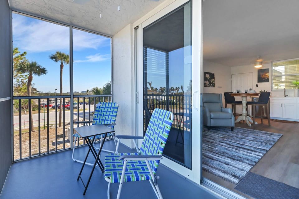 The screen enclosed balcony is a nice extension of the condos livingroom space.