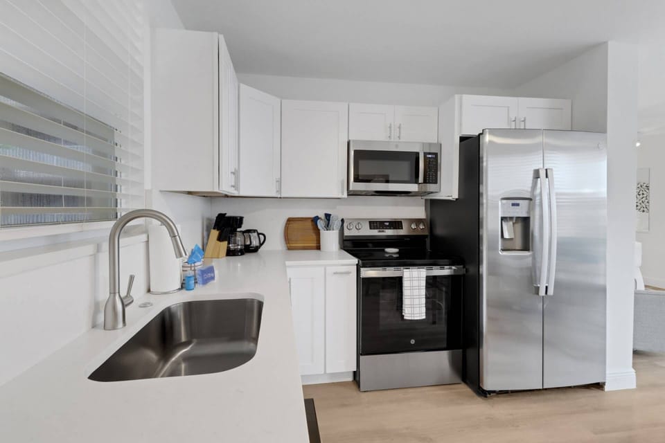 The newly remodeled kitchen includes full size oven, microwave, dishwasher and refrigerator/freezer with water and ice maker.