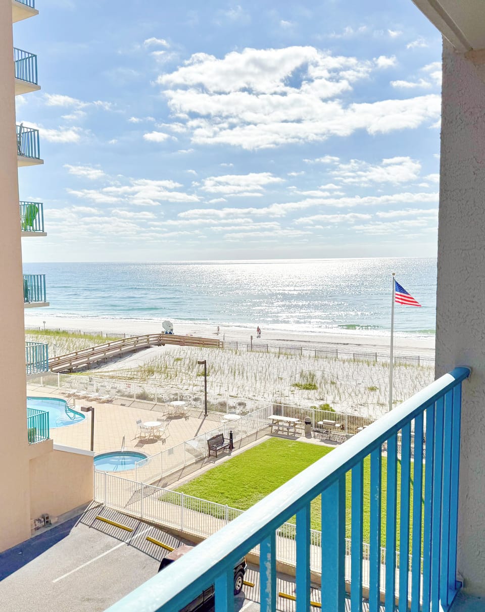 Two bedrooms have direct balcony access with views of the ocean