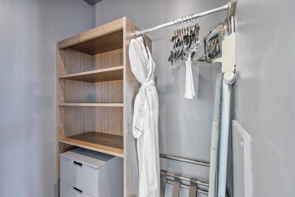 A closet with wooden shelves