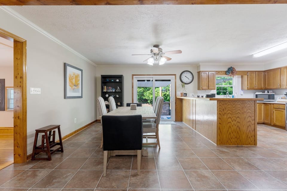 Charming kitchen with wooden cabinets, modern appliances, and generous space.