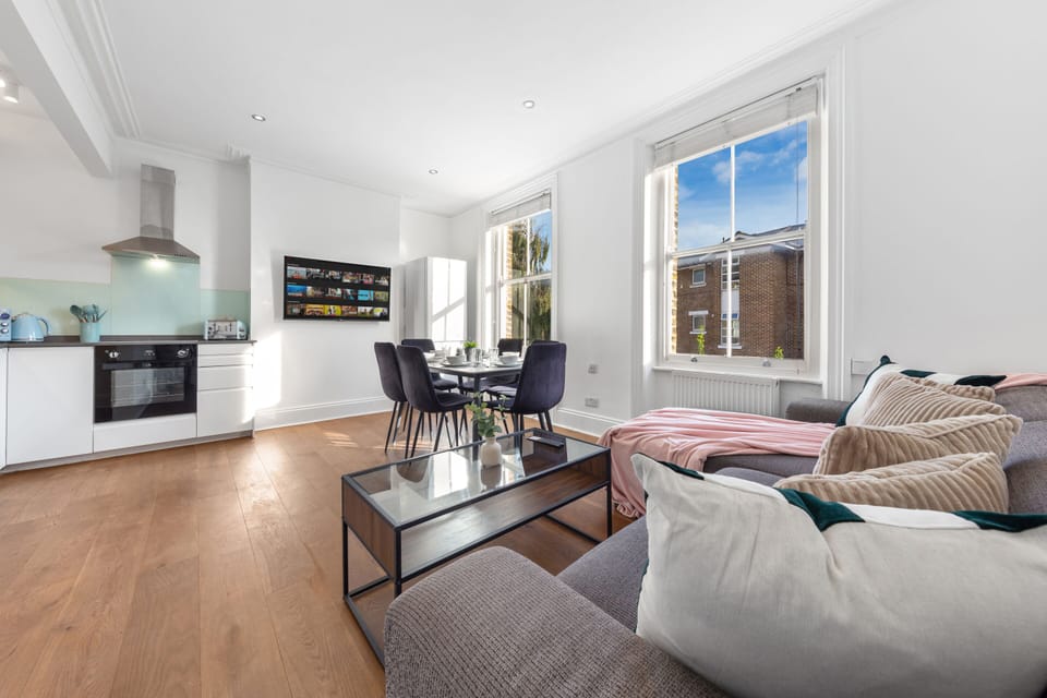 Spacious lounge with smart TV and comfy seating