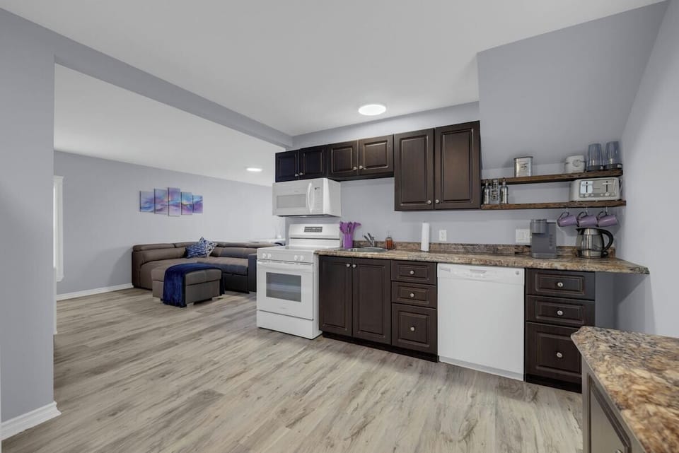 Kitchen, view of living room.