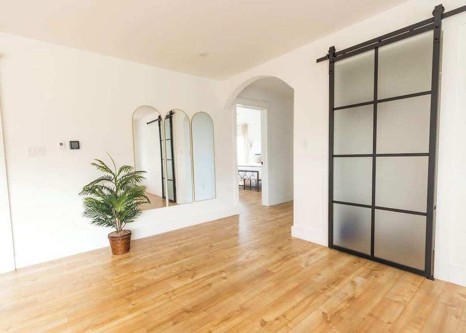 A view from the entrance as you walk in, coat/storage closet to your right and down that hall is where you'll find the master bedroom, the half bath and bedroom 2.