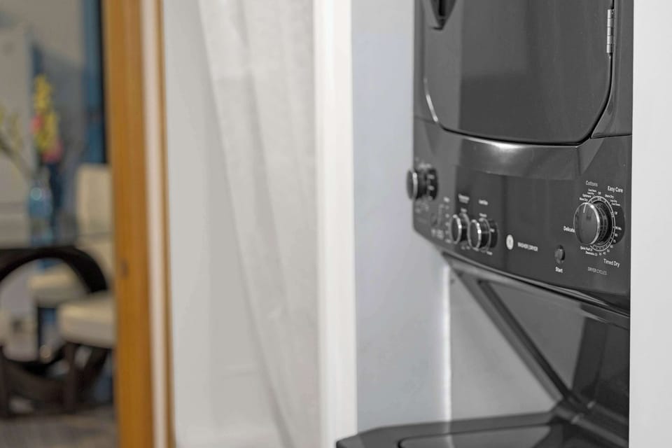Laundry Center located in bathroom for your stay!