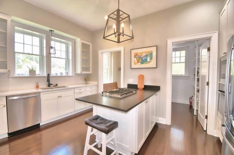 Large kitchen with seating for 2. Walk-in pantry/ laundry room, dishwasher, oven