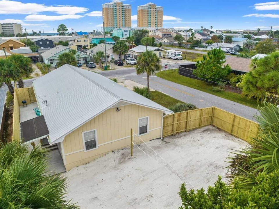 sand volleyball court fenced yard 