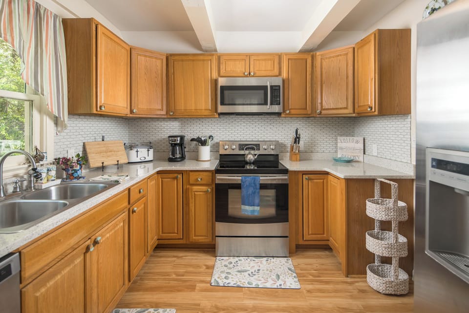 Fully equipped kitchen with stainless appliances.