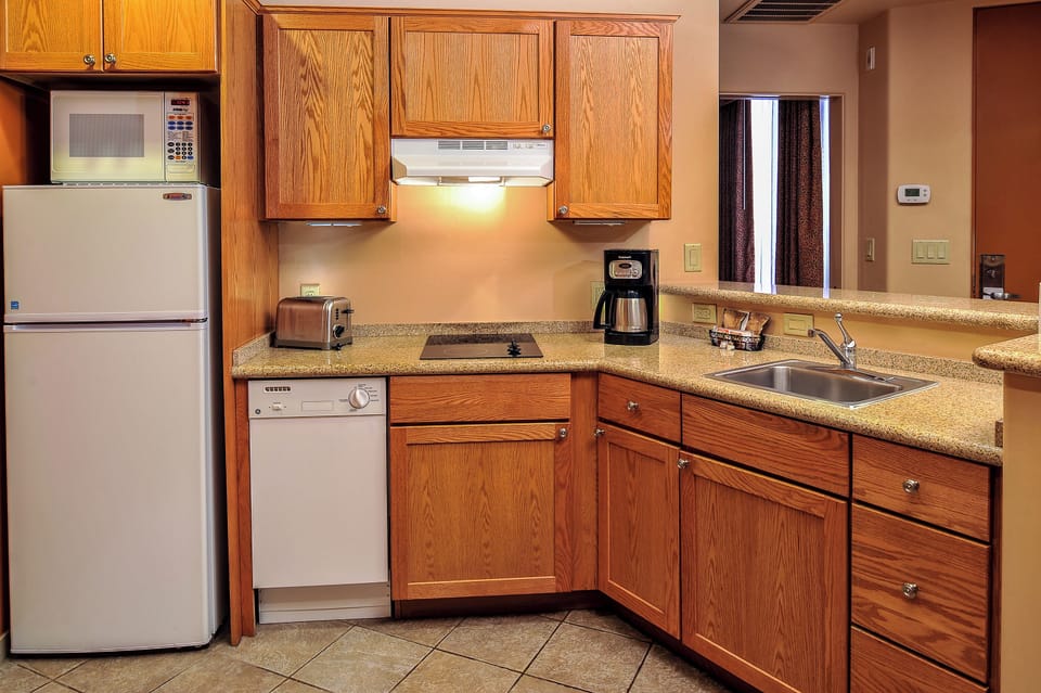 Prep snacks easily with fridge, dishwasher, and generous storage.