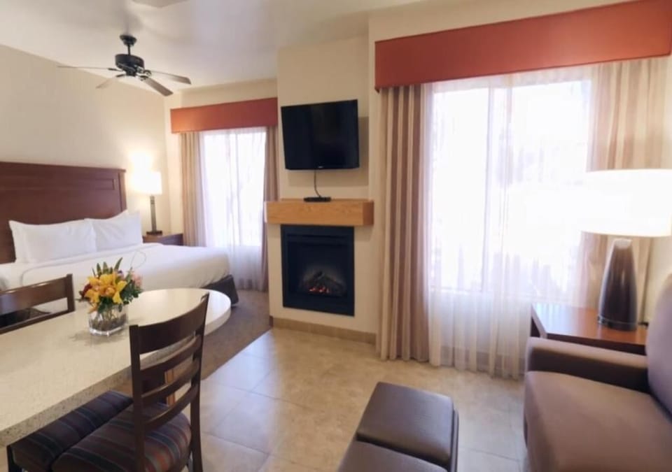 Step into a spacious suite with fireplace warmth and comfort.