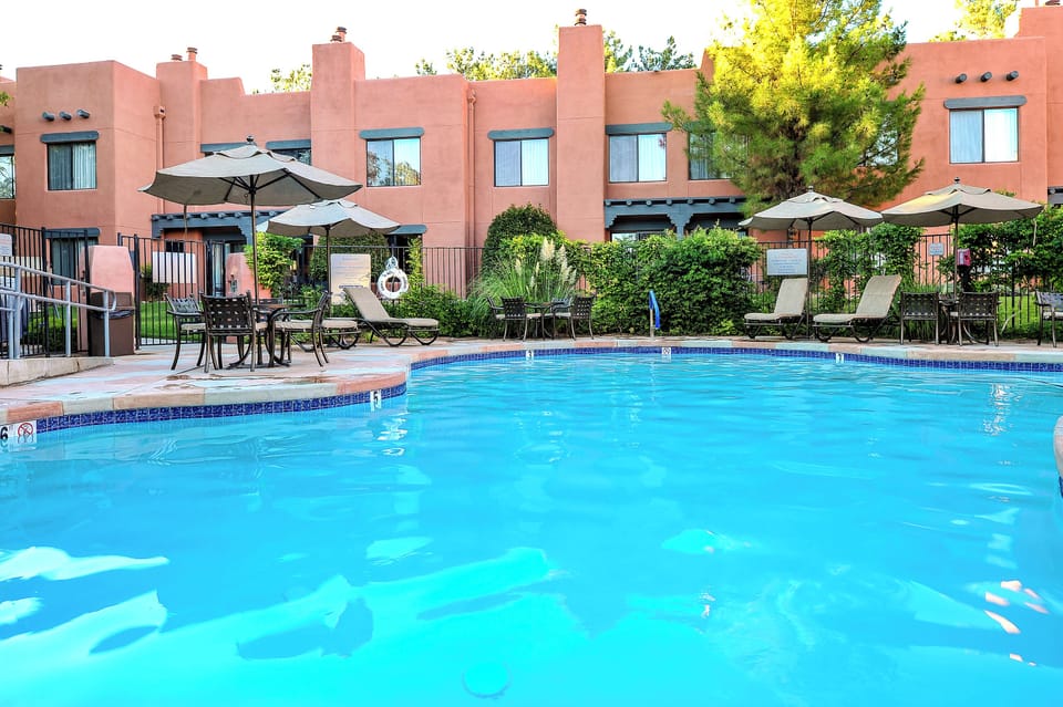 Unwind on shaded loungers with a refreshing swim steps away.