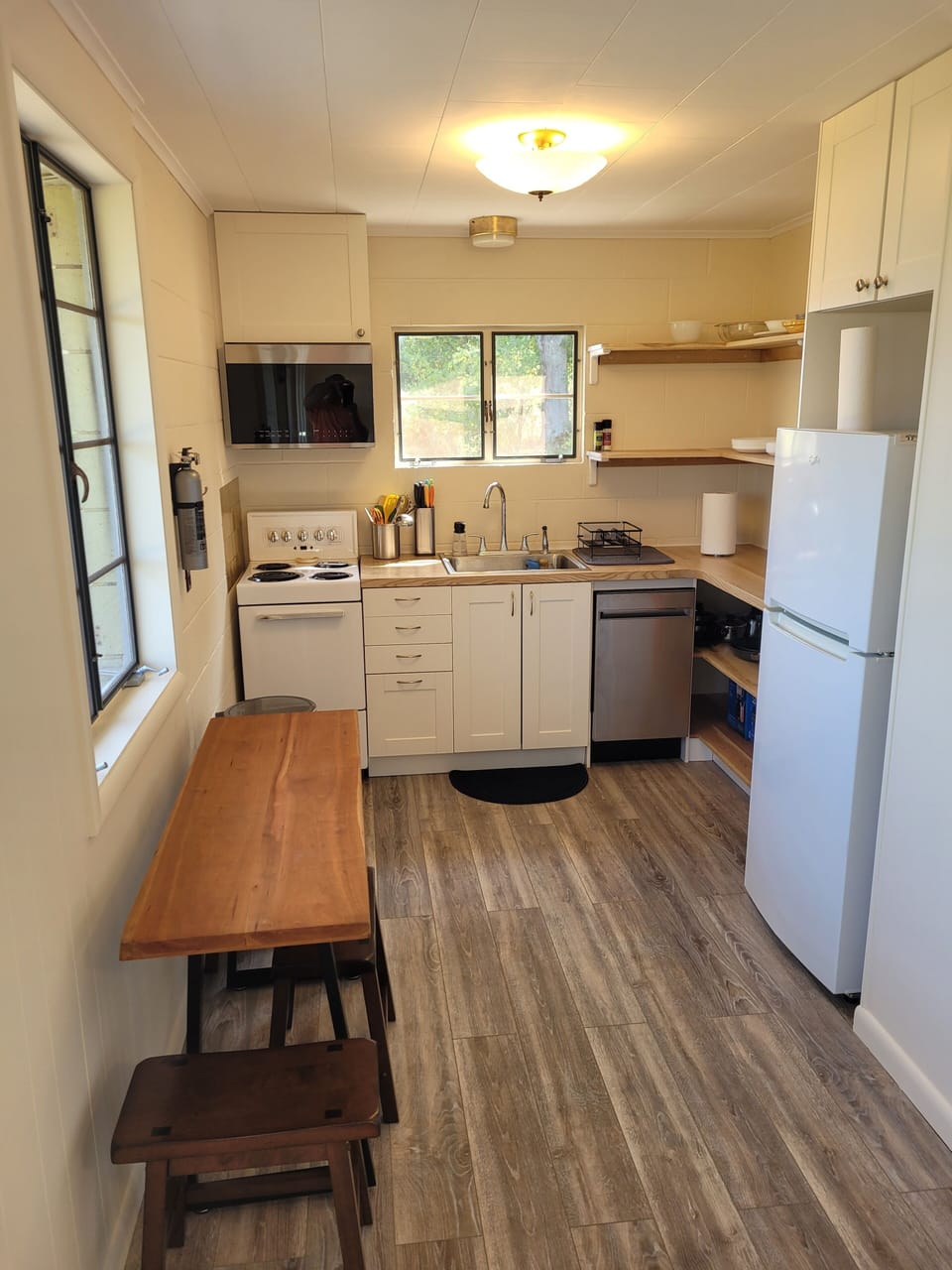 KITCHEN:  The home has a very cute and newly updated kitchen with all appliances, including a dishwasher.  Also includes a small breakfast nook with stools and a great view of Crystal Lake!