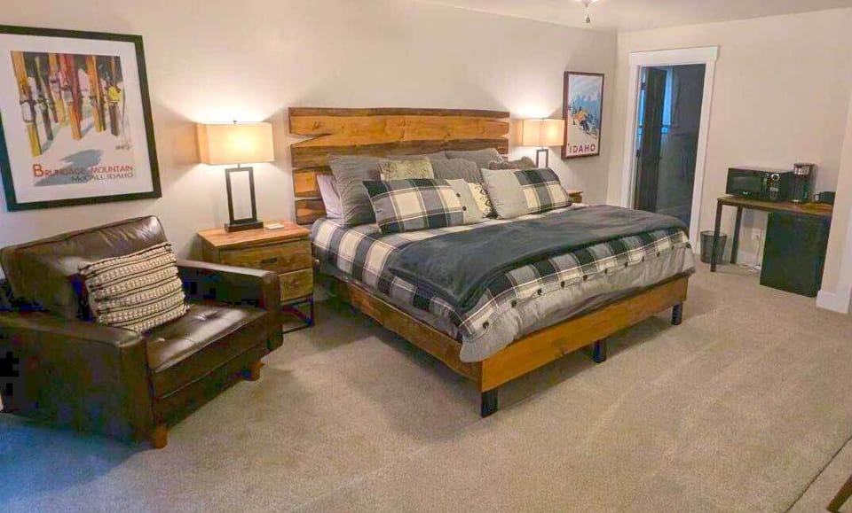 Cozy and comfortable king bed, side chair, and small desk for work. A mini-fridge and microwave with Keurig coffee maker is included.