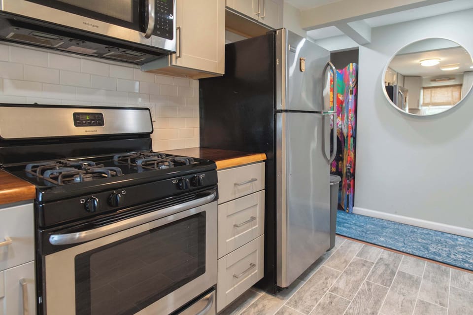 The kitchen offers ample cabinet space & all the comforts of home