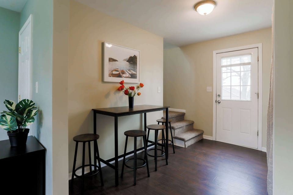 The dining table is nestled in the heart of the home & offers seating for 4